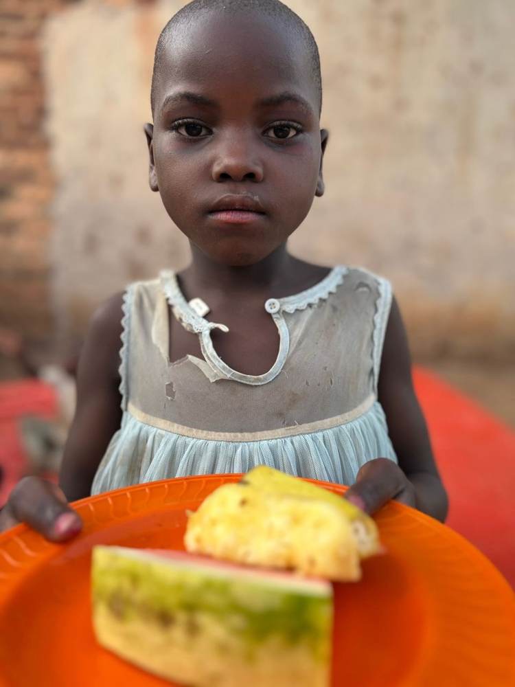 A child with a plate of food